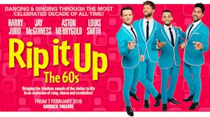 Four lead performers in suits