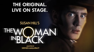 A man looking scared in a dark room